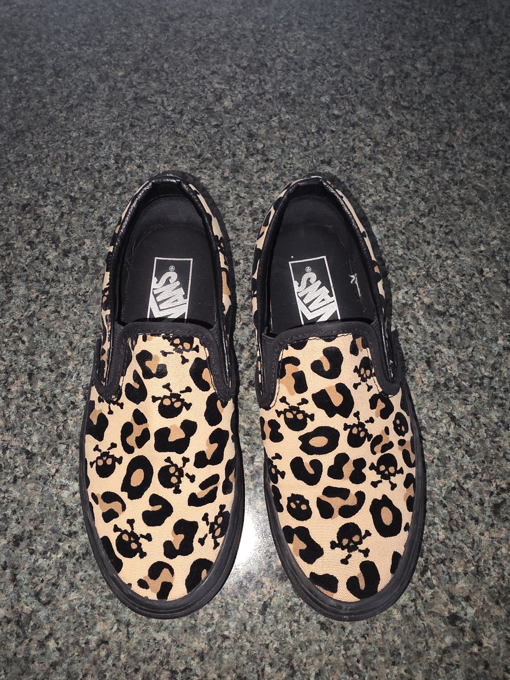 Vans Slip-On Sneakers in Leopard & Black Skull Print